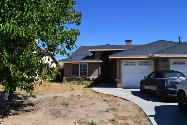 a view of a car park in front of house