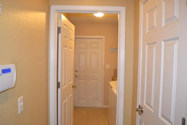 a bath room with a granite countertop sink and a mirror