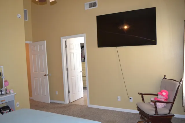 a bathroom with double vanity sinks and a mirror