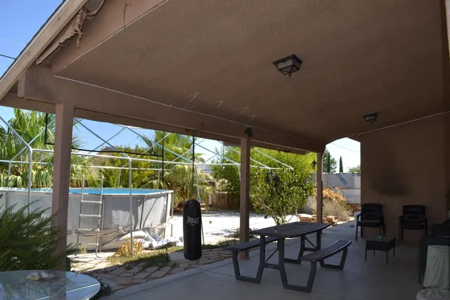 a front view of house with outdoor seating