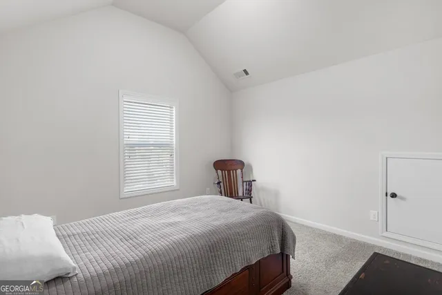 a bathroom with double vanity sinks and a mirror