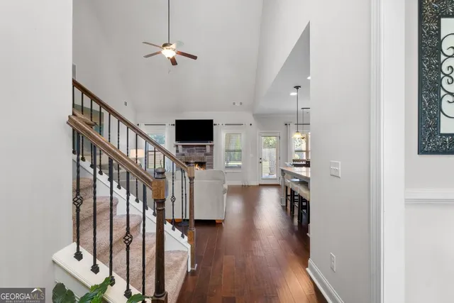 a view of entryway and hall with wooden floor