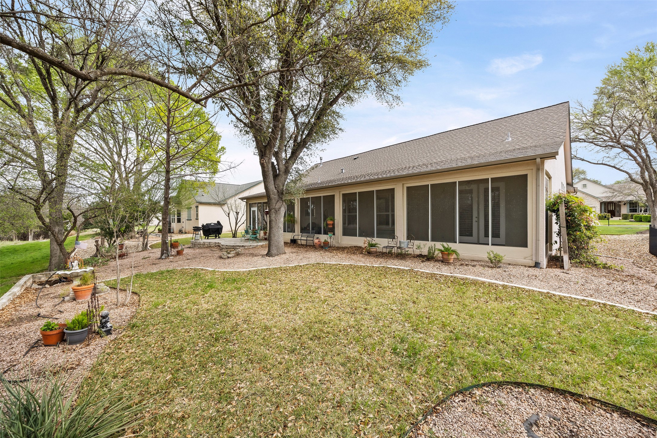 144 Stetson Trail Georgetown, TX 78633 - Photo 34 of 39 Back of property featuring a landscaped yard