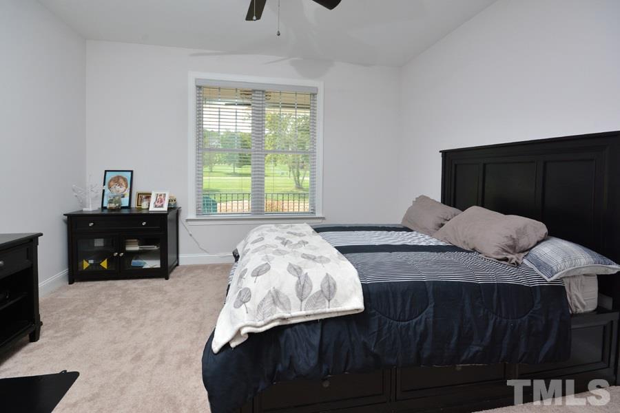 41 South Old Lantern Road Timberlake, NC 27583 - Photo 20 of 25 a bedroom with a bed and a tv on table