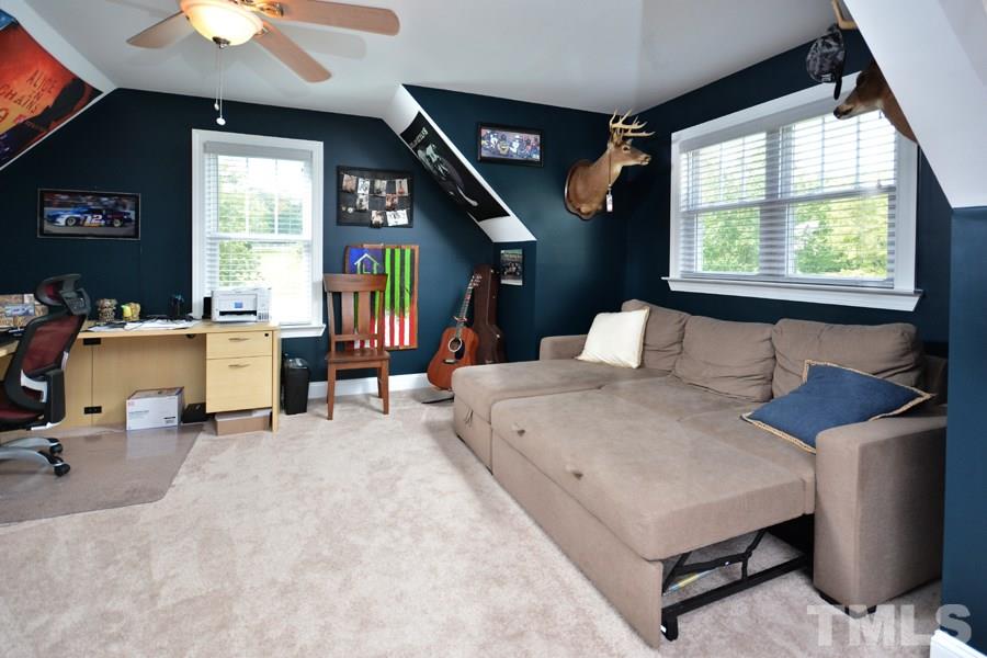 41 South Old Lantern Road Timberlake, NC 27583 - Photo 22 of 25 a bedroom with furniture and a large window