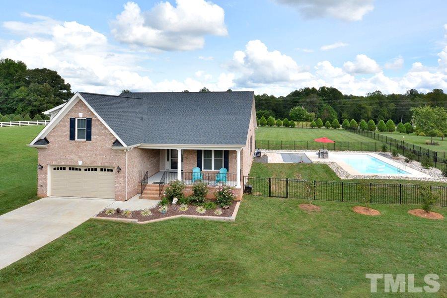 41 South Old Lantern Road Timberlake, NC 27583 - Photo 4 of 25 a front view of house with yard and green space