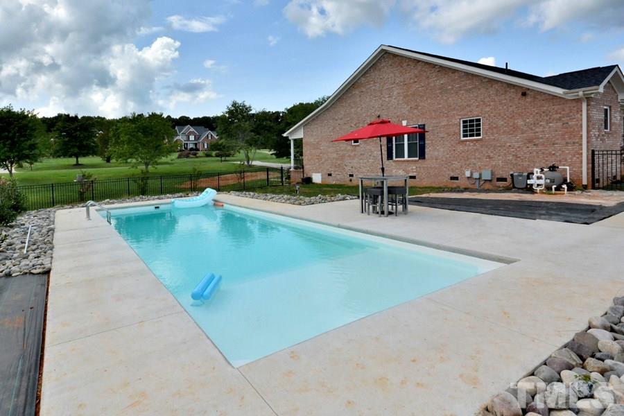 41 South Old Lantern Road Timberlake, NC 27583 - Photo 6 of 25 a view of a backyard with a patio