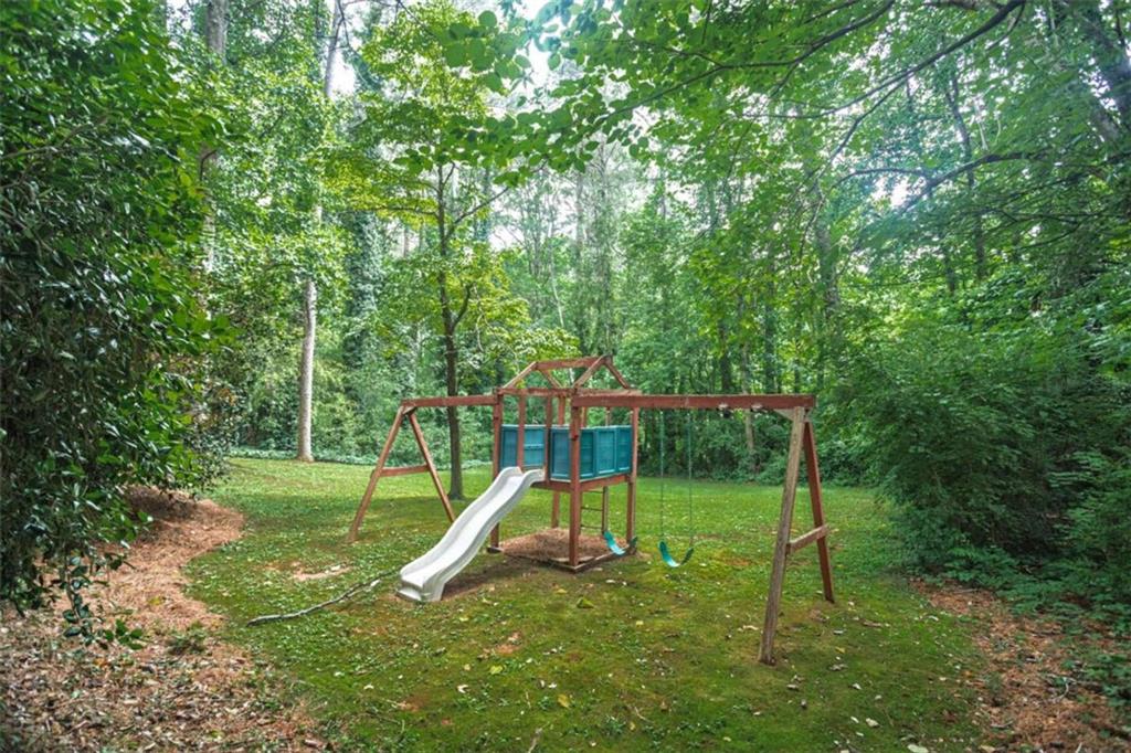 3838 Hunting Ridge Drive Southwest Lilburn, GA 30047 - Photo 56 of 56 a view of a park with a slide