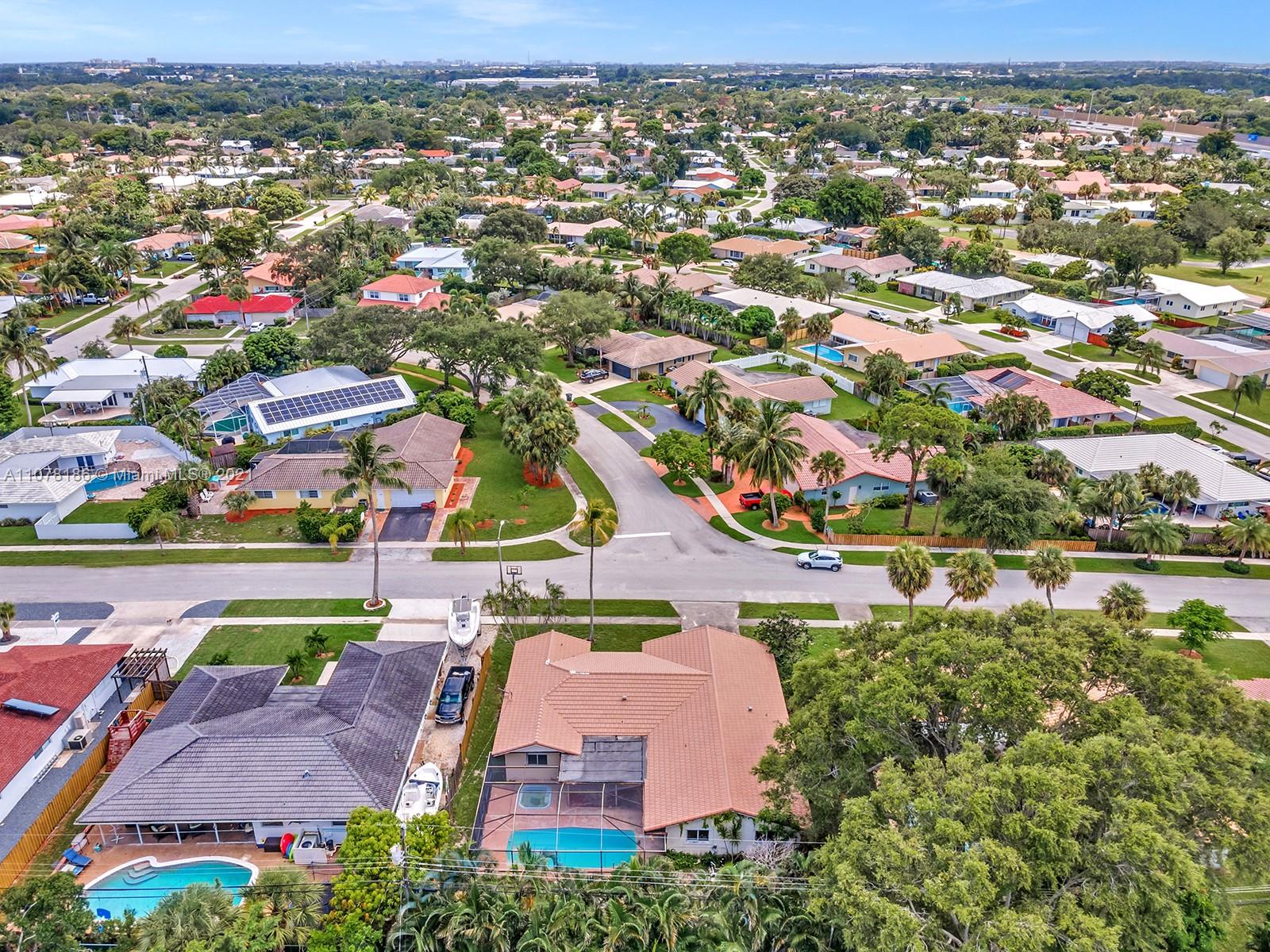 1359 Southwest 10th Street Boca Raton, FL 33486 - Photo 54 of 61 an aerial view of residential houses with outdoor space and swimming pool