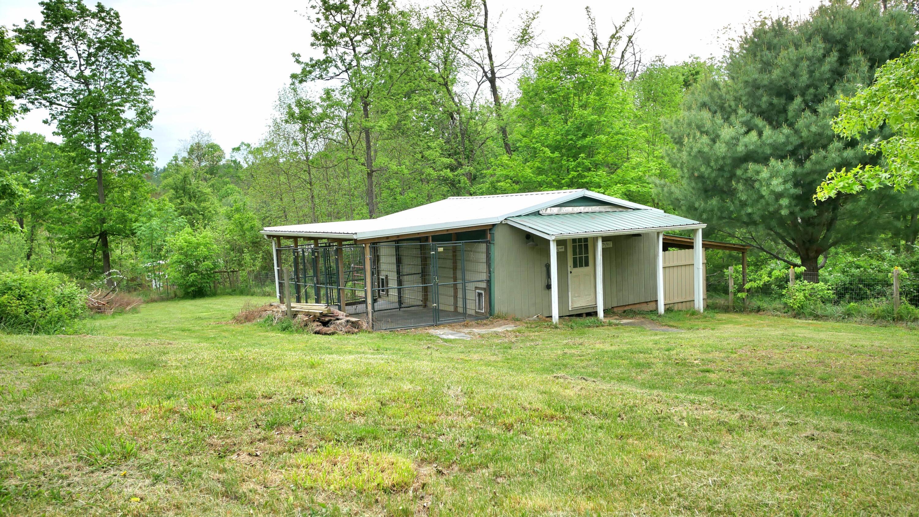 750 Upper Douda Road Malta, OH 43758 - Photo 28 of 44 Kennels with Pasture behind