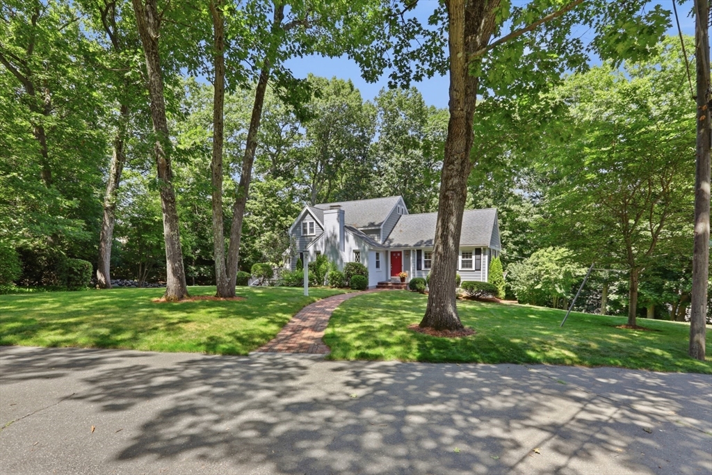 2 Olde Lyme Road Winchester, MA 01890 - Photo 37 of 42 a front view of a house with a yard and tree