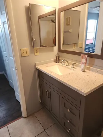 a bathroom with a sink and a mirror