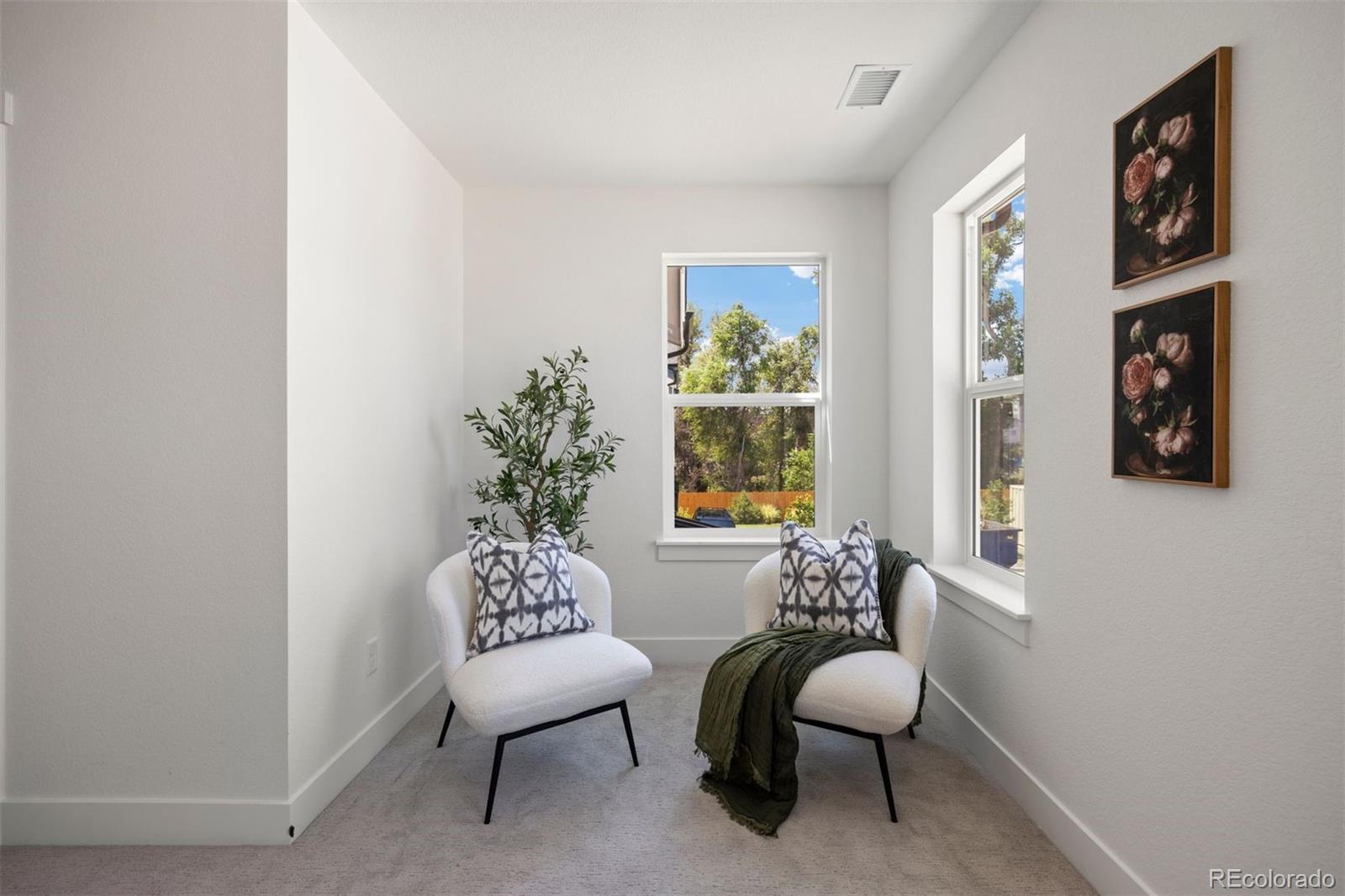 4000 Upham Street Wheat Ridge, CO 80033 - Photo 25 of 50 a living room with furniture and a potted plant