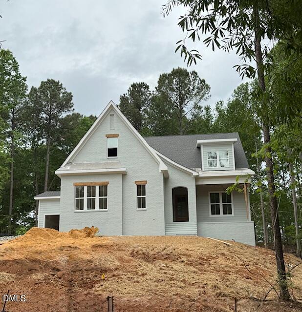 462 Chapel Ridge Drive Pittsboro, NC 27312 - Photo 3 of 7 a house with trees in the background