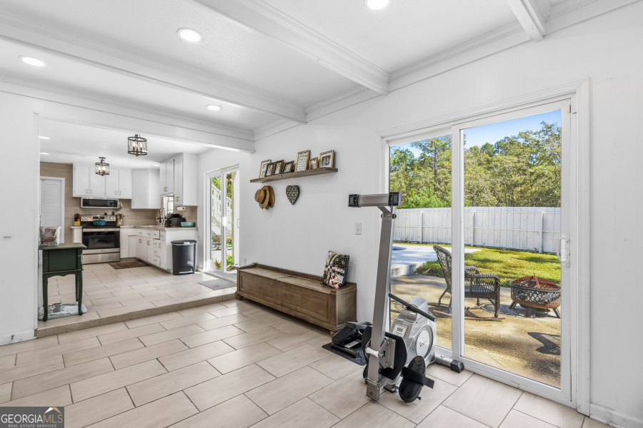 168 Pierce Street Jesup, GA 31545 - Photo 14 of 30 a view of a room with gym equipment and large window