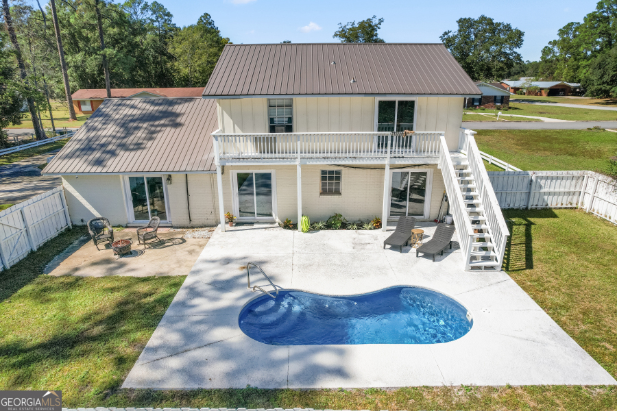 168 Pierce Street Jesup, GA 31545 - Photo 26 of 30 a view of a house with swimming pool