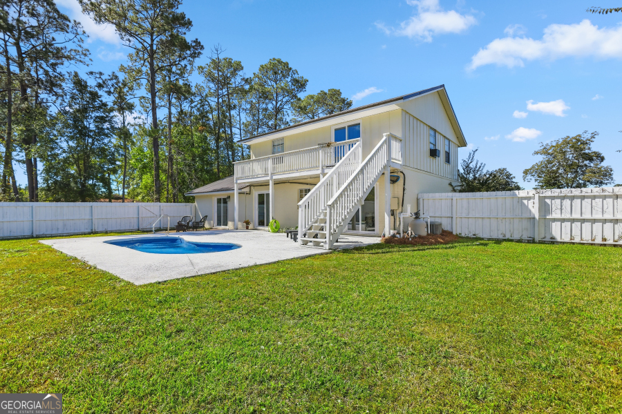 168 Pierce Street Jesup, GA 31545 - Photo 28 of 30 a view of an house with backyard and a tree
