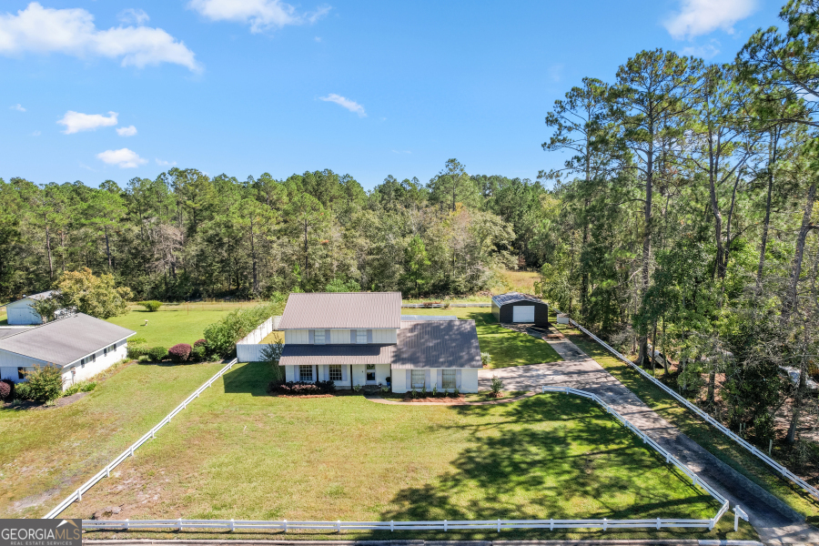 168 Pierce Street Jesup, GA 31545 - Photo 4 of 30 an aerial view of a house with a yard basket ball court and outdoor seating