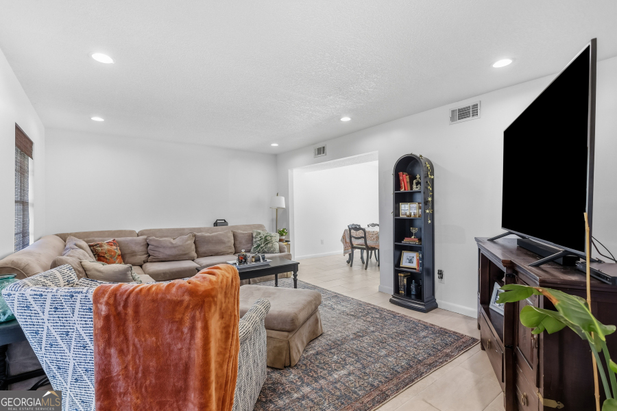 168 Pierce Street Jesup, GA 31545 - Photo 7 of 30 a living room with furniture and a flat screen tv