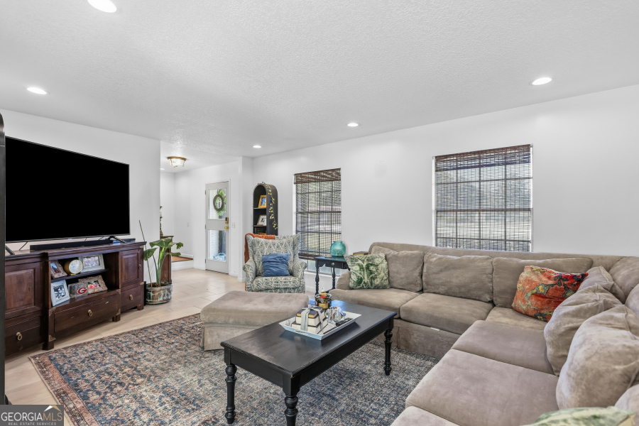 168 Pierce Street Jesup, GA 31545 - Photo 8 of 30 a living room with furniture and a flat screen tv
