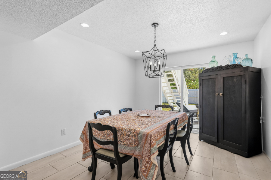 168 Pierce Street Jesup, GA 31545 - Photo 9 of 30 a view of a dining room with furniture and chandelier