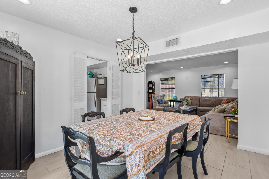 168 Pierce Street Jesup, GA 31545 - Photo 10 of 30 a view of a dining room with furniture and chandelier