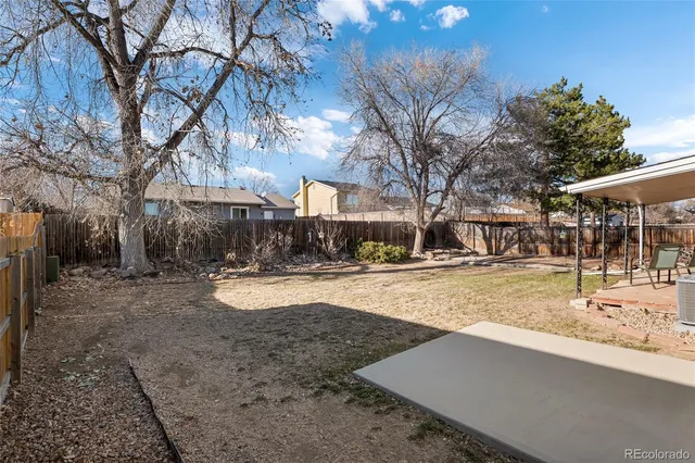 a view of a yard with snow on the road