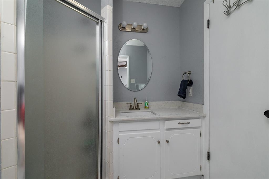 6020 Harrison Way Watauga, TX 76148 - Photo 23 of 32 Bathroom featuring vanity and a shower stall