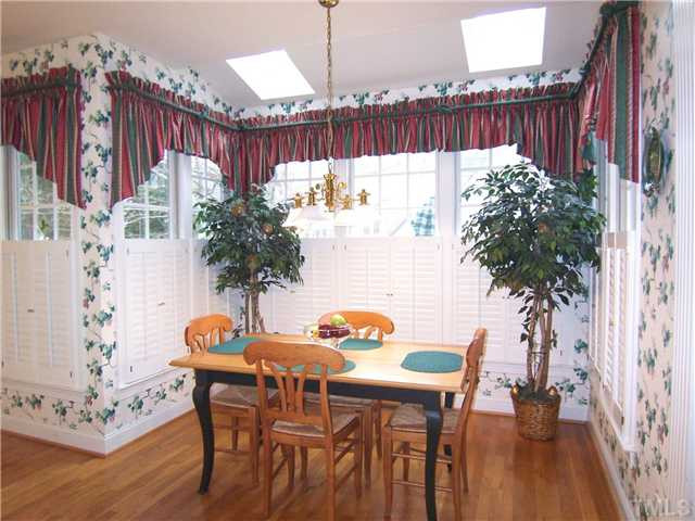 9101 Kettner Court Raleigh, NC 27615 - Photo 12 of 25 View of the sunny Bfast area w/2 skylights & a desk. Breakfast Area