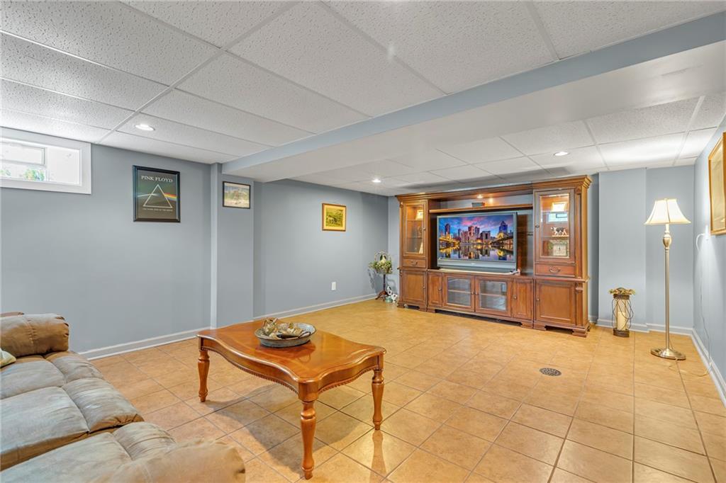 383 Ridgemont Drive Midland, PA 15059 - Photo 19 of 44 a living room with furniture and a flat screen tv