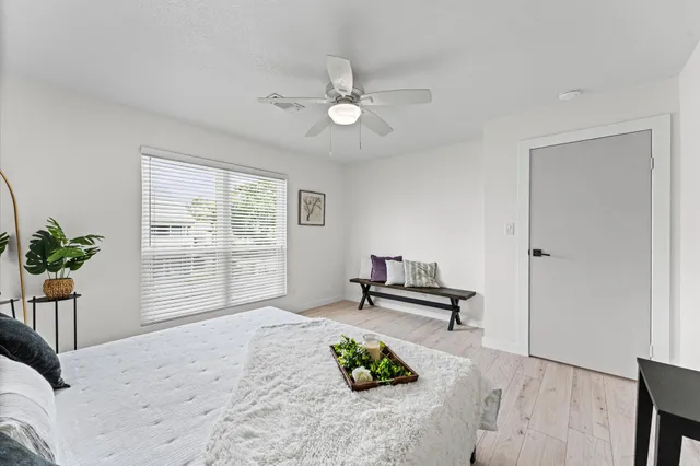 a living room with furniture and large window