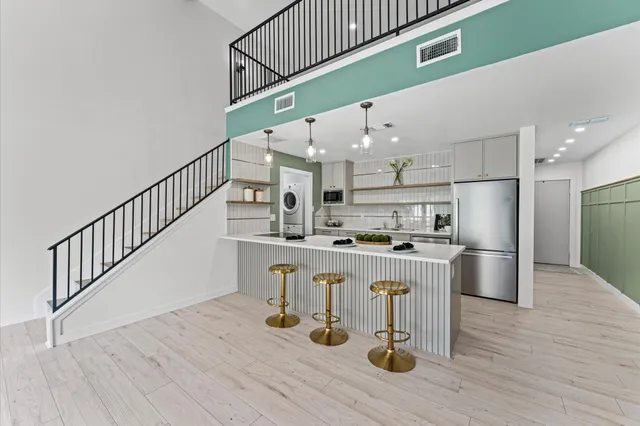a kitchen with wooden cabinets and sink