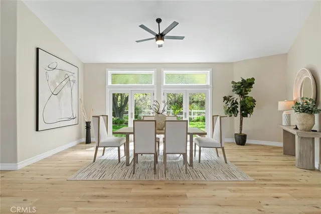 a view of a livingroom with furniture and a table and chair