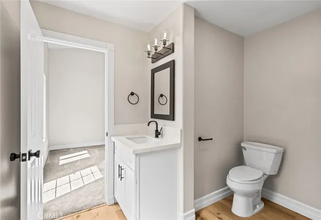 a bathroom with a double vanity sink a mirror and a window