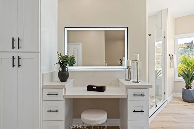 a view of a white building with a swimming pool