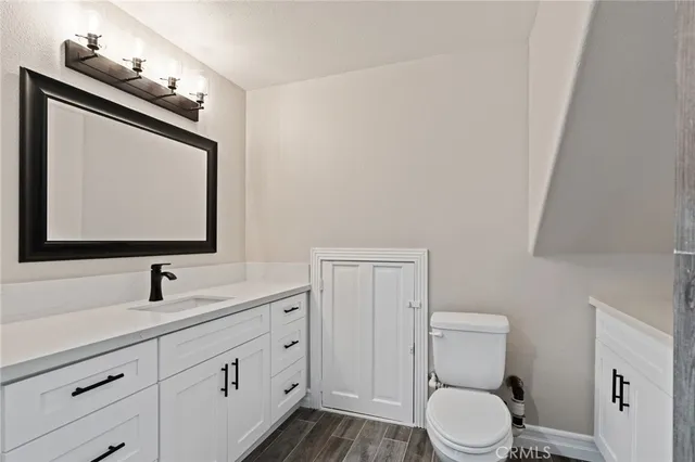 a view of a dry yard with mountains in the background