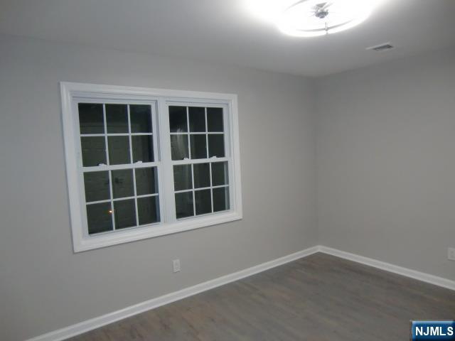 291 Liberty Road Englewood, NJ 07631 - Photo 22 of 49 a view of empty room with windows