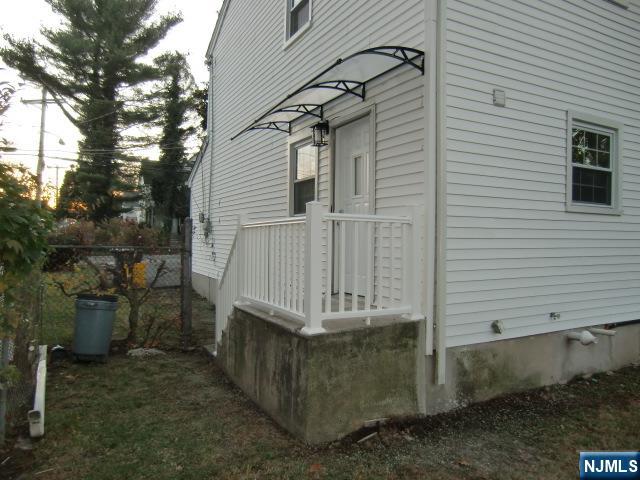 291 Liberty Road Englewood, NJ 07631 - Photo 44 of 49 a view of a small house with a yard