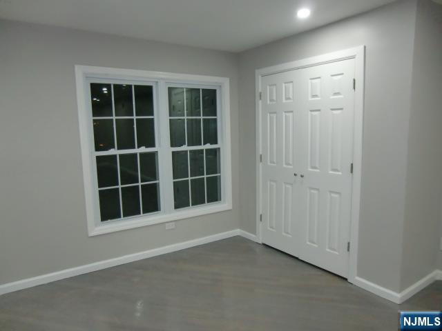 291 Liberty Road Englewood, NJ 07631 - Photo 9 of 49 an empty room with windows and cabinet
