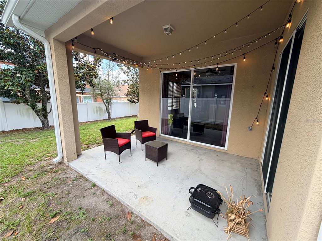 13250 Mandalay Place Spring Hill, FL 34609 - Photo 24 of 28 a view of a porch with furniture and yard