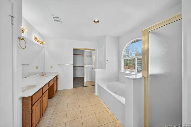 a kitchen with granite countertop a refrigerator and a sink