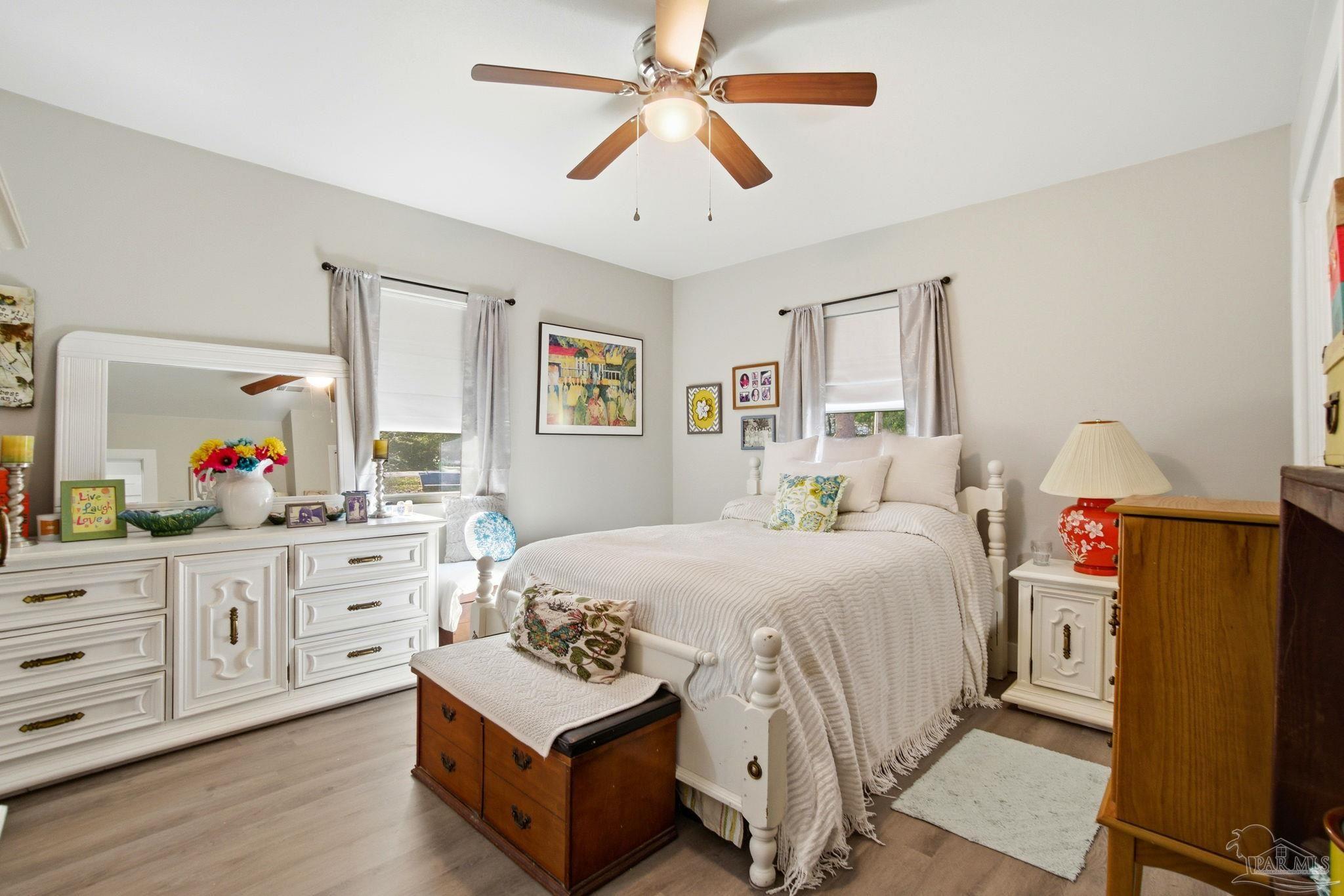 148 San Carlos Road Cantonment, FL 32533 - Photo 21 of 38 a bedroom with bed cabinets and window