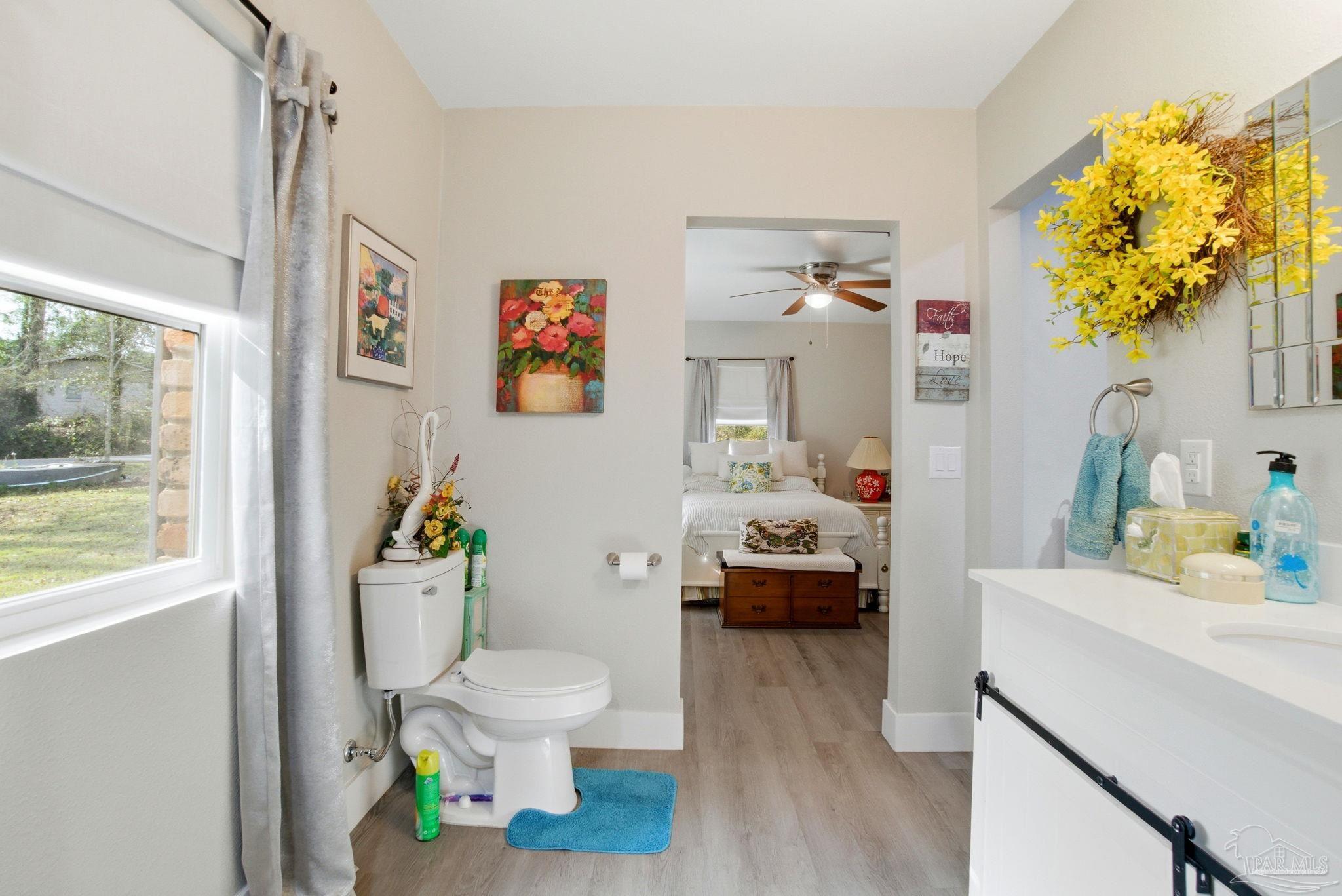 148 San Carlos Road Cantonment, FL 32533 - Photo 26 of 38 a living room with furniture and a window