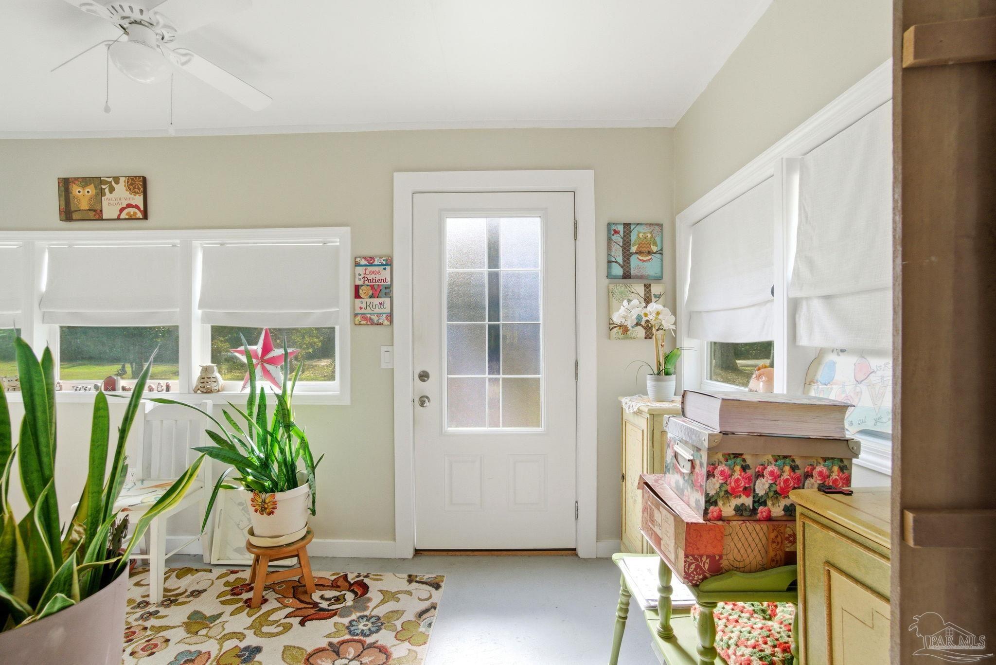 148 San Carlos Road Cantonment, FL 32533 - Photo 6 of 38 a living room filled with furniture