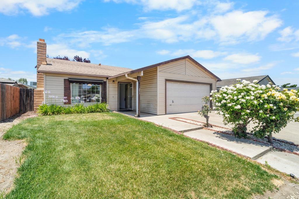 a house view with a garden space
