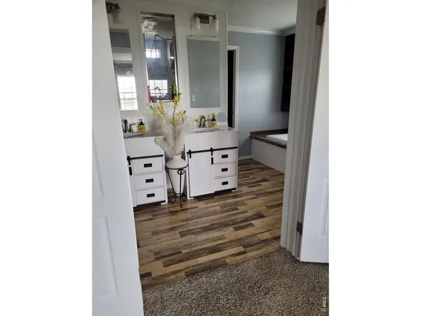 a bed room with a bed and a painting