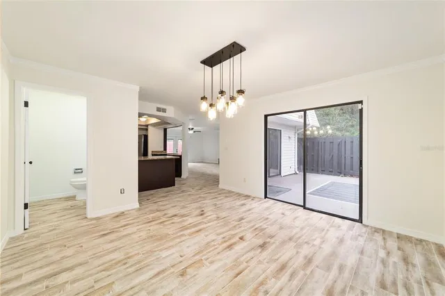 a view of an empty room with a bathroom