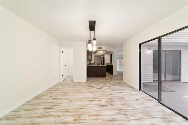 a big room with closet and windows