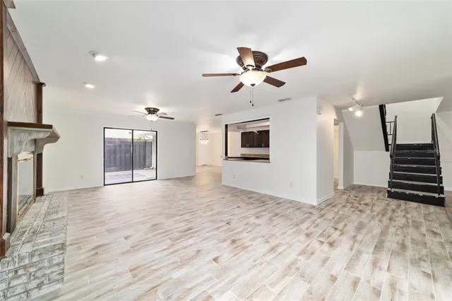 a view of an empty room with a fireplace