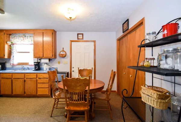 a dining room with furniture and window